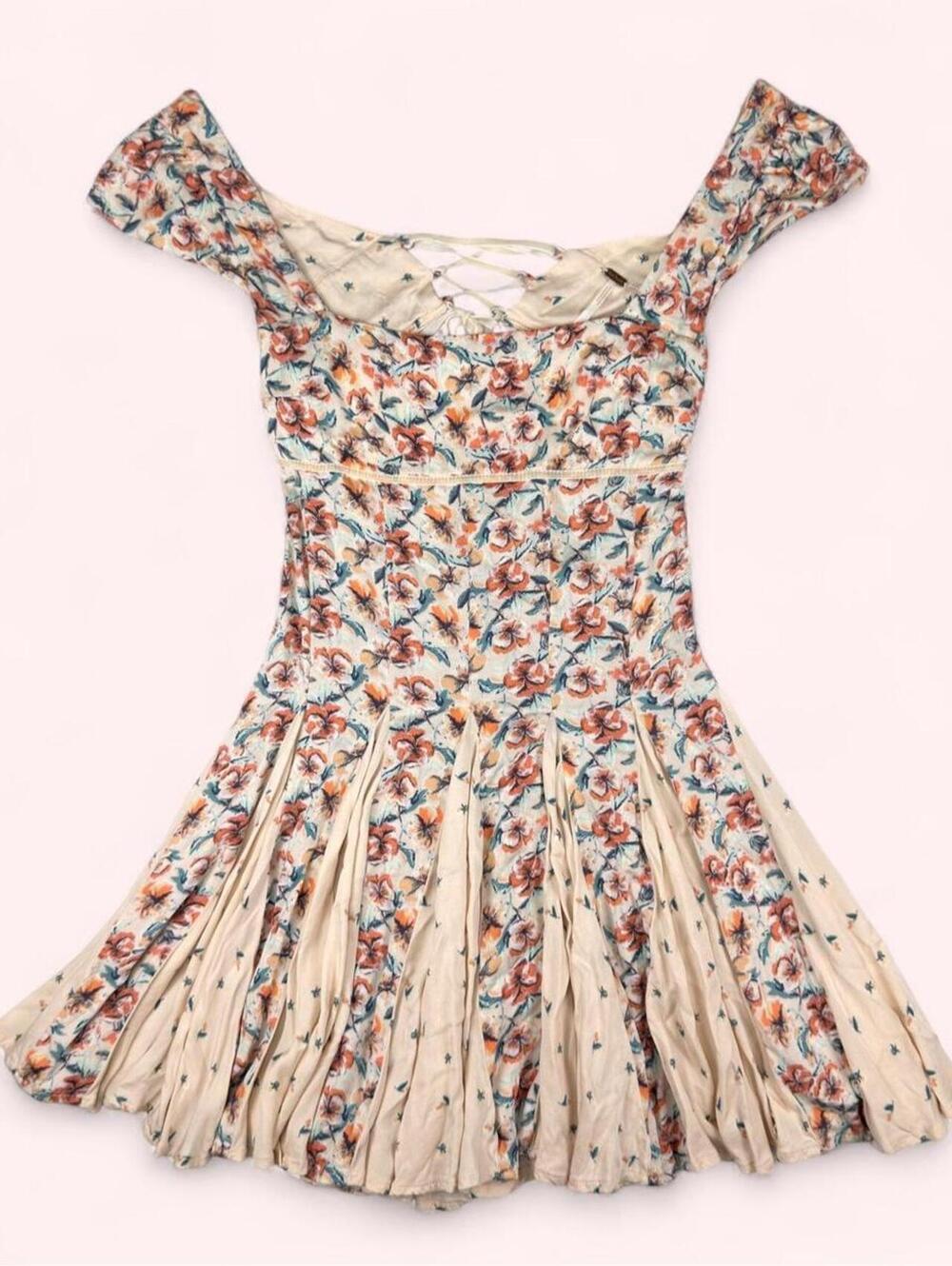 Free People cream floral mini dress with crisscross back tie